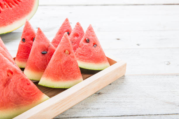 Watermelon on wooden table background stock photo