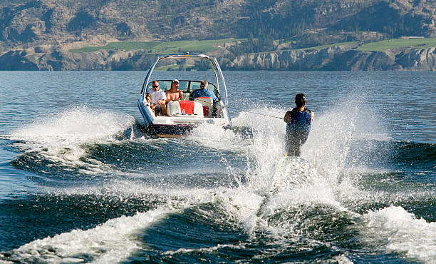 waterskiing water skiier seen from behind motorboat stock pictures, royalty-free photos & images