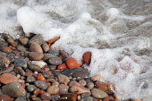 istock Wave and pebbles 1339691688