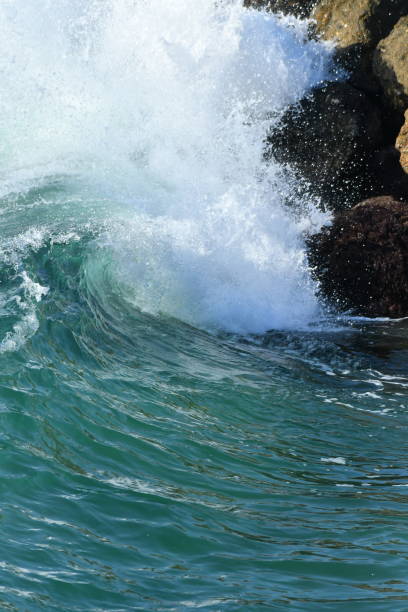 Wave Breaking along a Harbor Wall Redondo Beach Harbor steven harrie stock pictures, royalty-free photos & images