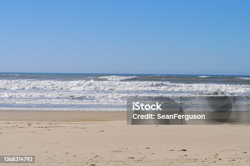 istock Waves pounding onto Beach 1368314792
