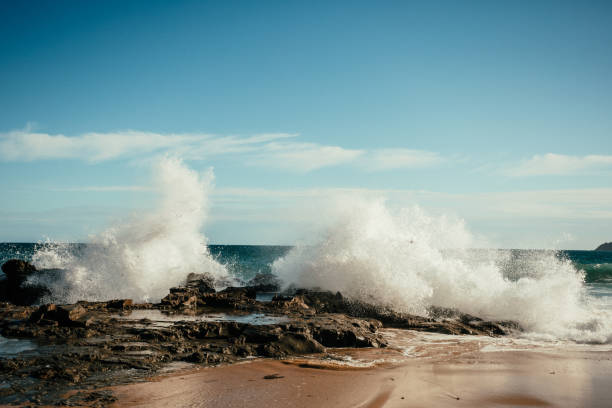 Waves Splashing on the rocks stock photo