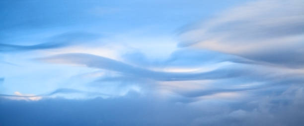 Wavy clouds in the morning light Beautiful wavy clouds in the morning light, background in soft colors altostratus stock pictures, royalty-free photos & images