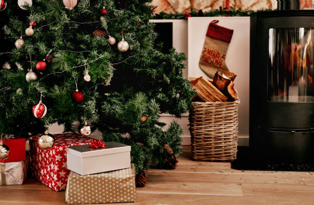 Cropped shot of a bunch of presents placed under a Christmas tree ready to be opened in the morning