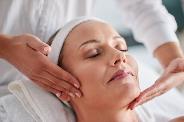 We just want to help you banish wrinkles Shot of a mature woman getting a facial treatment at a spa indulgence stock pictures, royalty-free photos & images