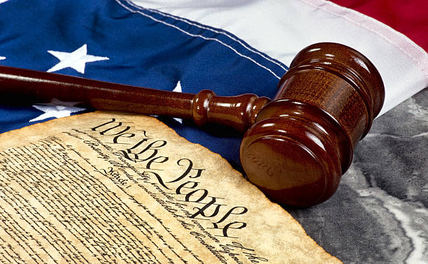 We the People. Wooden gavel on top of American flag and Bill of Rights document bills patriots stock pictures, royalty-free photos & images