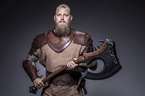 Weapon wielding viking warrior in studio shot stock photo