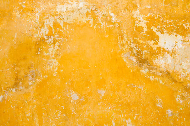 Weathered concrete wall background Close-up texture background image of a weathered concrete wall in Antigua, Guatemala.. peeling off stock pictures, royalty-free photos & images