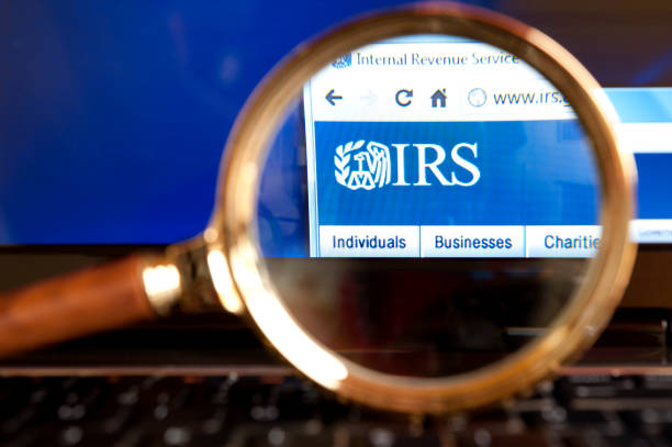 IRS website through a magnifying glass stock photo