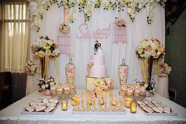 Wedding cake and candy bar. Table with sweets stock photo