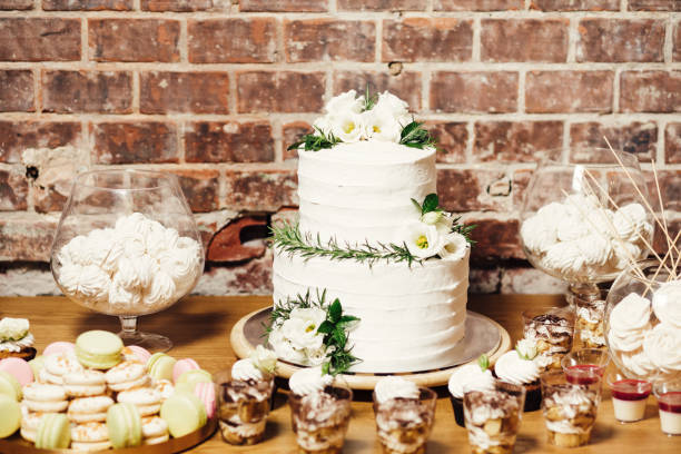 Wedding catering, table with modern desserts and cupcakes. stock photo