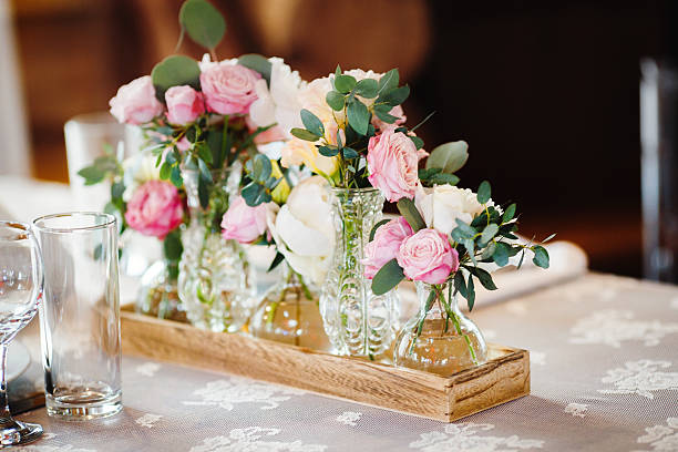wedding decor with pink peonies and roses Wedding table decoration with pink peonies and carnations, roses centerpiece stock pictures, royalty-free photos & images