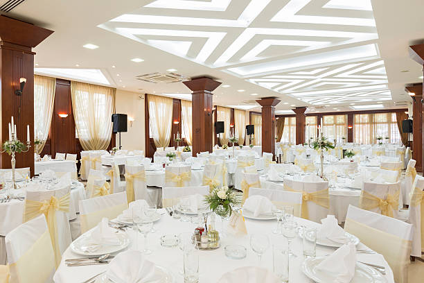 Wedding hall or other function facility set for fine dining Wedding hall or other function facility set for fine dining wedding reception stock pictures, royalty-free photos & images