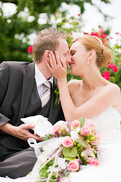 Wedding - kissing in park