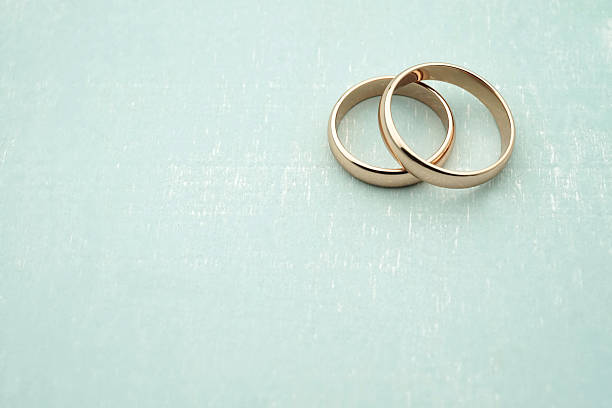 Wedding rings in rose gold with copy space stock photo