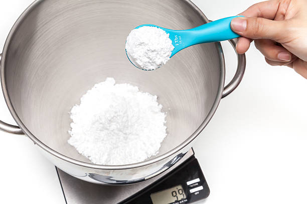 Weighing flour on the digital scale stock photo