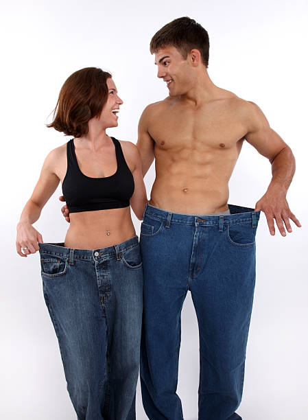 Weight loss couple stock photo