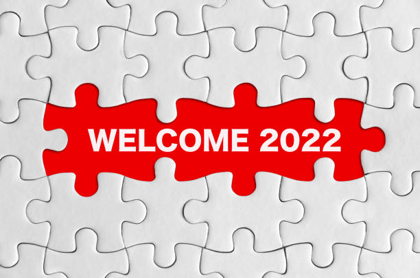 Welcome 2022, Jigsaw puzzle concept. stock photo