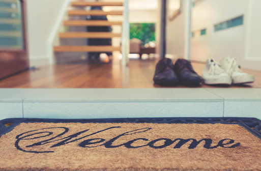 Welcome Mat At The Open Front Door Stock Photo - Download Image Now ...