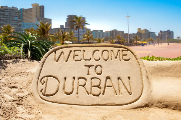welcome to durban sand sculpture Welcome to Durban sand sculpture with skyline of Durban waterside in the background durban stock pictures, royalty-free photos & images