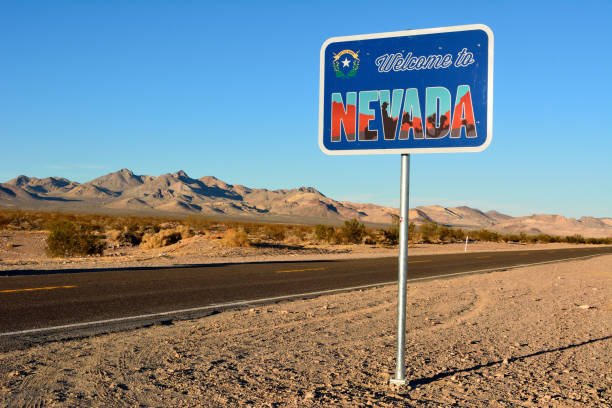 Welcome to Nevada road sign along a highway. stock photo
