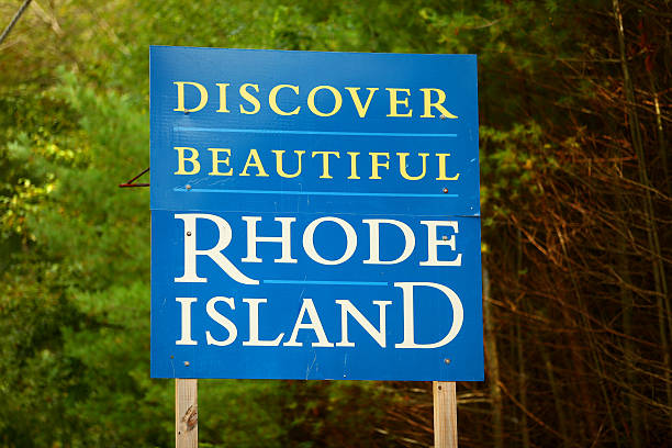 Welcome to Rhode Island sign Welcome to Rhode Island sign at the Connecticut state line west of Providence, Rhode Island along state route 101. rhode island stock pictures, royalty-free photos & images