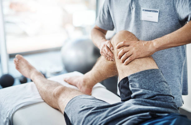We'll sort out these sprains and strains Closeup shot of an unrecognizable physiotherapist treating a patient physical therapy stock pictures, royalty-free photos & images