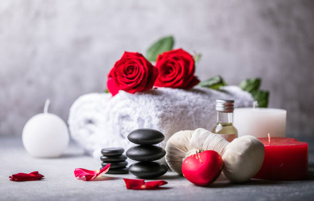 Wellness decoration, spa massage setting,  oil on stone background. Valentine's Day Zen and relax concept. stock photo