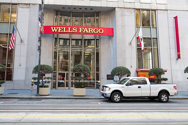 Wells Fargo San Francisco, California, United States - September 26, 2016: Signage with logo at headquarters of Wells Fargo Capital Finance, the commercial banking division of Wells Fargo Bank, in the Financial District neighborhood of San Francisco, California, September 26, 2016 wells fargo stock pictures, royalty-free photos & images