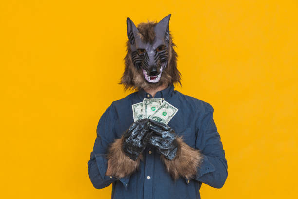 A werewolf with 50 dollar bills stock photo
