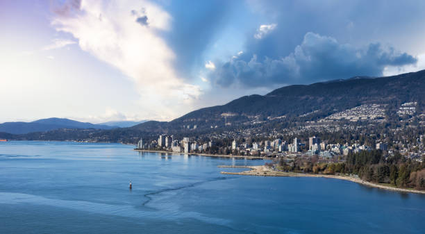 West Vancouver, British Columbia, Canada. West Vancouver, British Columbia, Canada. Aerial Panoramic View of a modern cityscape on the Pacific Ocean Coast. Sunset Sky Art Render. west vancouver stock pictures, royalty-free photos & images