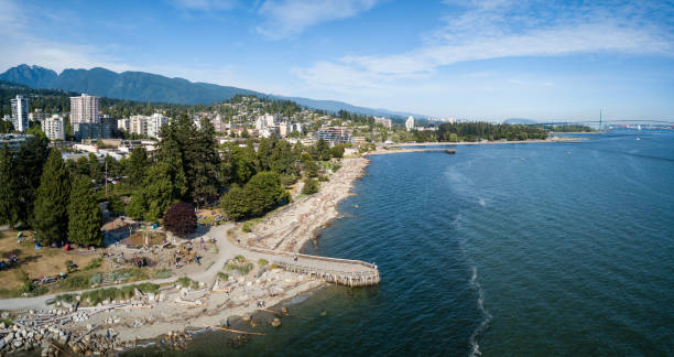 West Vancouver Aerial panoramic view of luxury residential homes on a beautiful rocky shore during a vibrant sunny summer day. Taken in West Vancouver, British Columbia, Canada. west vancouver stock pictures, royalty-free photos & images
