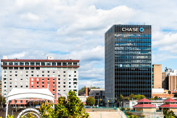 West Virginia capital city cityscape skyline with Chase bank and logo on building Charleston, USA - October 17, 2019: West Virginia capital city cityscape skyline with Chase bank and logo on building and cloudy sky chasing stock pictures, royalty-free photos & images