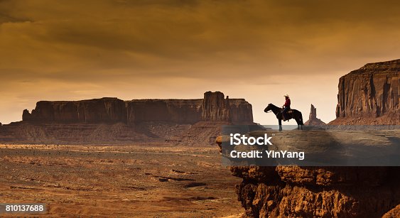 istock Western Cowboy Native American on Horseback at Monument Valley Tribal Park 810137688