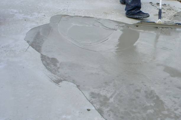 Wet Concrete Overlay with Worker stock photo