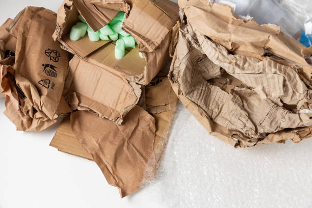 Wet damaged crumpled cardboard parcel stock photo