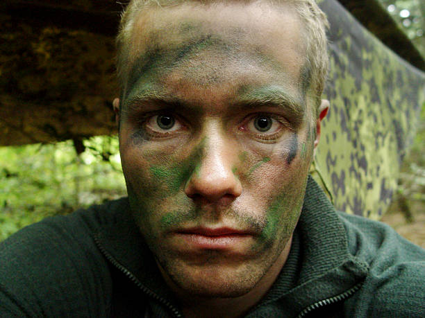 What 5 days of patrol with no sleep looks like Yuri Arcurs - in camouflage facial paint looking very tired after a hard mission. This shot is from real life, during the Kosovo war militia stock pictures, royalty-free photos & images