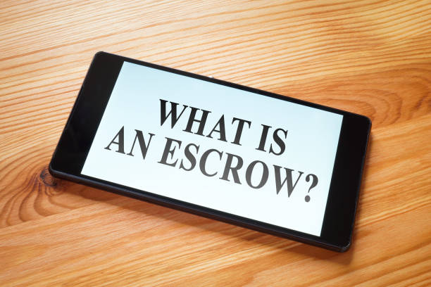 What is an escrow question on a smartphone screen. escrow agreement stock pictures, royalty-free photos & images