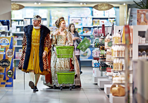 What say ye to this brand, my lady? A king and queen browsing in a supermarket snob stock pictures, royalty-free photos & images