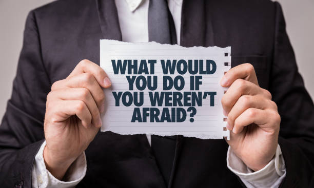 What Would You Do If You Weren't Afraid? What Would You Do If You Weren't Afraid? paper sign fear stock pictures, royalty-free photos & images