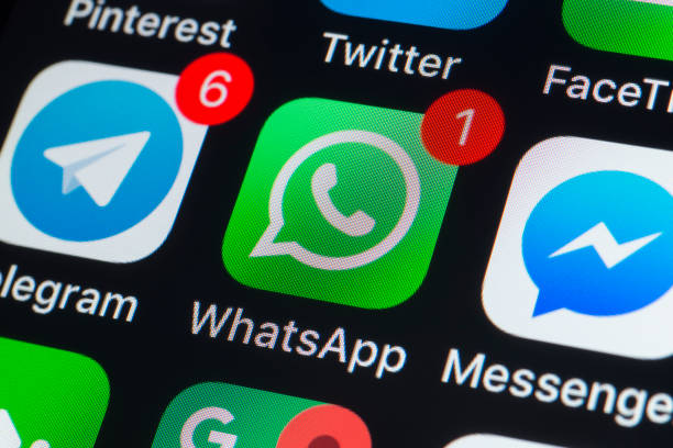 Whatsapp, Messenger, Telegram and other phone chat Apps on iPhone screen London, UK - July 19, 2018: The buttons of Whatsapp, Messenger, Telegram, Pinterest Twitter, Facetime and other chat apps on the screen of an iPhone. whatsapp stock pictures, royalty-free photos & images