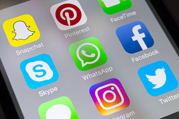 Whatsapp, Skype, Facebook and social media apps on cellphone stock photo