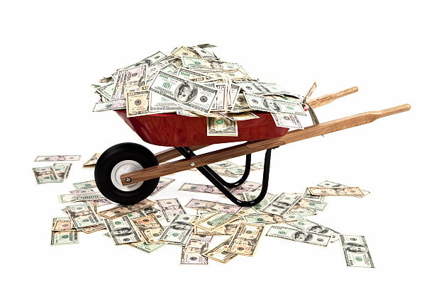 Wheelbarrow Full of Money stock photo