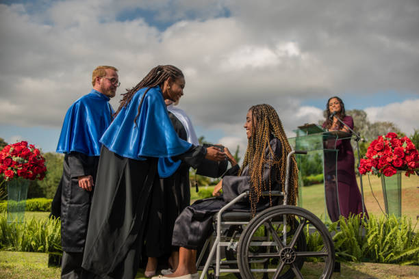 Wheelchair woman graduating. Wheelchair woman graduating. medical degrees stock pictures, royalty-free photos & images