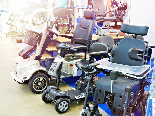 Wheelchairs with electric motor in store stock photo
