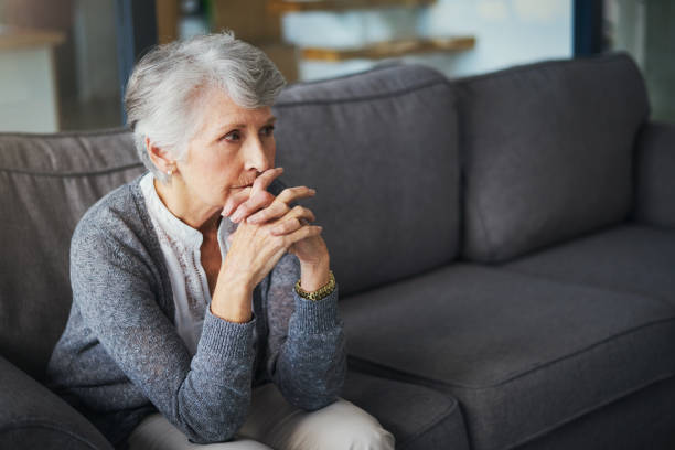 Where to from here? Shot of a senior woman suffering from stress at home worried stock pictures, royalty-free photos & images