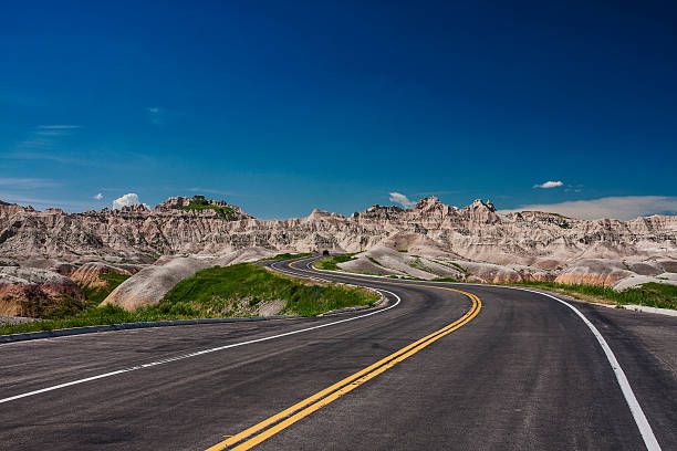 Where will the road take you Badlands, North Dakota, USA, June 2nd 2014, driving through the rock formations of badlands national park north dakota stock pictures, royalty-free photos & images