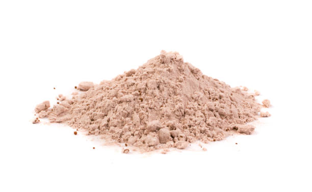 Whey cocoa protein powder for brown fitness shake isolated Whey cocoa protein powder for brown fitness shake isolated on white background . Chocolate supplement powder pile close up pea protein powder stock pictures, royalty-free photos & images