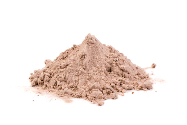 Whey cocoa protein powder for brown fitness shake isolated Whey cocoa protein powder for brown fitness shake isolated on white background . Chocolate supplement powder pile close up pea protein powder stock pictures, royalty-free photos & images