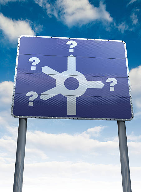 Which way? direction signpost with question marks, indecision stock photo